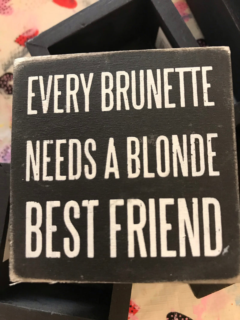 blond and brunette sign